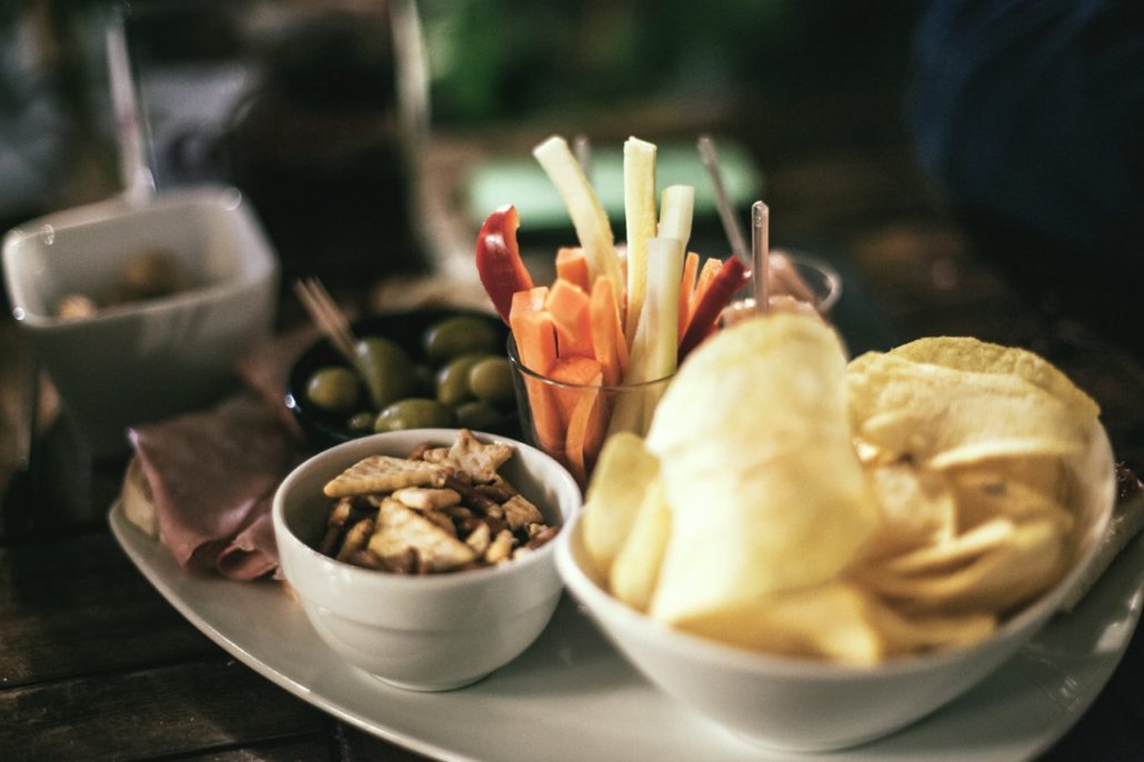 Chips, Crackers, and Vegetables on Platter